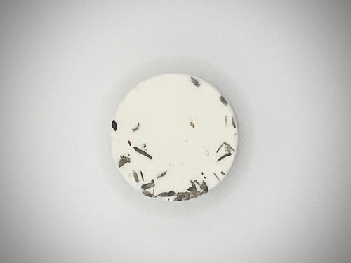 shower steamer tab on a gray background